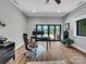 Bright office space with a lake view, modern desk setup, and ample natural light at 1579 Sunset Pointe Dr, Salisbury, NC 28146