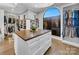 Spacious walk-in closet with custom storage, an island with drawers, and natural light at 1579 Sunset Pointe Dr, Salisbury, NC 28146