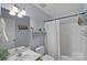 Bathroom featuring a shower-tub combo, a single sink vanity, and neutral wall color at 160 Kingfisher Dr, Mooresville, NC 28117