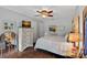Serene bedroom features a dresser, comfortable bed, and soft lighting, creating a relaxing retreat at 160 Kingfisher Dr, Mooresville, NC 28117