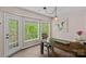 Dining room with rustic wood table, view of backyard and lots of natural light at 160 Kingfisher Dr, Mooresville, NC 28117