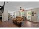 Spacious living room showcasing hardwood floors, a comfortable seating area, and bright, natural light at 160 Kingfisher Dr, Mooresville, NC 28117