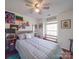 This cozy bedroom features a ceiling fan, closet, and is filled with natural light, with an open concept at 1715 Colin Creek Ln, Charlotte, NC 28214