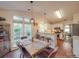 Open concept dining area featuring bar seating and a breakfast nook at 1715 Colin Creek Ln, Charlotte, NC 28214