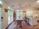 Cozy dining area with vaulted ceilings, natural light, and breakfast bar at 1715 Colin Creek Ln, Charlotte, NC 28214