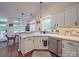 Bright kitchen featuring white cabinets, stainless steel appliances, and hardwood floors, perfect for cooking and entertaining at 1715 Colin Creek Ln, Charlotte, NC 28214