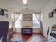 Bright home office features hardwood floors, natural light from windows and a modern ceiling fan at 1715 Colin Creek Ln, Charlotte, NC 28214