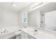 Bathroom showcasing a bathtub, stand-up shower and large mirror at 185 Hunters Point Dr, Rockwell, NC 28138