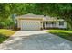 Charming single-story home featuring a two-car garage and inviting front porch at 185 Hunters Point Dr, Rockwell, NC 28138