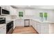 Modern kitchen featuring stainless steel appliances, white cabinets, and quartz countertops at 185 Hunters Point Dr, Rockwell, NC 28138