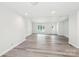 Bright and airy living room featuring neutral paint, recessed lighting, and wood-look flooring at 185 Hunters Point Dr, Rockwell, NC 28138