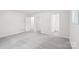 Large main bedroom with neutral carpet showing multiple closets and en suite bathroom at 185 Hunters Point Dr, Rockwell, NC 28138
