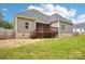 Backyard with a wooden deck and stairs leading to the lawn at 205 Sheffield Dr, York, SC 29745
