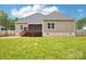 Backyard with a wooden deck and stairs leading to the lawn at 205 Sheffield Dr, York, SC 29745