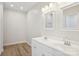 Bright bathroom featuring a double vanity with modern fixtures and wood-look floors at 205 Sheffield Dr, York, SC 29745