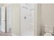 Bathroom with a new shower unit with shelves and a modern toilet at 205 Sheffield Dr, York, SC 29745