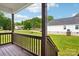 Front porch with stained wood and railing with a beautiful view of the neighborhood at 205 Sheffield Dr, York, SC 29745