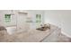 Modern kitchen island with granite countertops, stainless steel sink, and white cabinetry at 205 Sheffield Dr, York, SC 29745