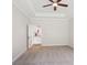 Carpeted Main bedroom with a tray ceiling and a view of the kitchen at 205 Sheffield Dr, York, SC 29745