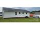 Home exterior with white siding, an AC unit, and a grassy yard at 2109 Boggs St, Lincolnton, NC 28092