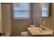 Bathroom features a vanity sink, toilet and tub/shower combo with a window at 2109 Boggs St, Lincolnton, NC 28092