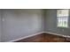 Cozy bedroom with wood floors, gray walls and window at 2109 Boggs St, Lincolnton, NC 28092
