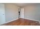 Bedroom with hardwood floors and a window, offering a bright and inviting space at 2109 Boggs St, Lincolnton, NC 28092
