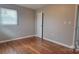 Bedroom with hardwood floors and a window, offering a bright and inviting space at 2109 Boggs St, Lincolnton, NC 28092