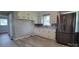 Updated kitchen with stainless steel appliances, granite countertops and white cabinets at 2109 Boggs St, Lincolnton, NC 28092