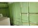 Laundry room in need of repair featuring painted walls, wiring, and laundry machine at 2109 Boggs St, Lincolnton, NC 28092