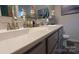 Close up of bathroom double vanity with white counter and gray cabinets at 2220 Sussex Rd, York, SC 29745