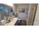 Bathroom featuring double vanity with gray cabinets, tub and shower combination, and neutral decor at 2220 Sussex Rd, York, SC 29745