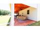 Inviting covered patio with wood ceiling, ceiling fans, and outdoor seating, creating a relaxing backyard space at 2220 Sussex Rd, York, SC 29745