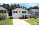 This two-story home has white siding, blue shutters and features a well-manicured front yard at 2220 Sussex Rd, York, SC 29745