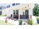 Inviting front porch with rocking chairs, decorative plants, and a welcoming 'hello' sign at 2220 Sussex Rd, York, SC 29745
