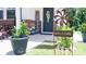 Charming front porch adorned with welcome decor, plants, and flowers, creating an inviting entrance at 2220 Sussex Rd, York, SC 29745