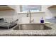 The modern kitchen sink features a gooseneck faucet, granite countertops, and tiled backsplash at 2220 Sussex Rd, York, SC 29745