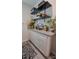 Bright laundry room features custom cabinets, stylish countertop, and decorative shelving, offering both functionality and aesthetic appeal at 2220 Sussex Rd, York, SC 29745