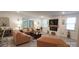 Bright living room with modern furnishings, a cozy fireplace, and large windows at 2220 Sussex Rd, York, SC 29745