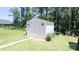 Well-maintained storage shed in a spacious backyard with a walkway, providing convenient outdoor storage solutions at 2220 Sussex Rd, York, SC 29745