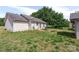 Spacious backyard featuring a patio, lush greenery, and a charming shed in a serene setting at 244 Whitesides Rd, Bessemer City, NC 28016