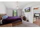 Vaulted ceiling bedroom featuring a wooden bed frame, a ceiling fan, and a view into an adjacent room at 244 Whitesides Rd, Bessemer City, NC 28016