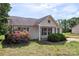 Quaint home with well-manicured lawn and garden showcasing simple curb appeal and mature landscaping at 244 Whitesides Rd, Bessemer City, NC 28016