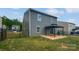 View of the backyard featuring a gazebo and patio, framed by a sleek black metal fence at 250 Marinna Joy Cir, Rockwell, NC 28138