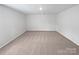 Unfinished basement with neutral carpet, offering a blank canvas for customization at 250 Marinna Joy Cir, Rockwell, NC 28138