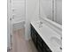 A modern bathroom featuring a double sink vanity, toilet, and tiled tub and shower at 250 Marinna Joy Cir, Rockwell, NC 28138