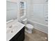 Full bathroom with a tub, toilet, vanity, and a window for natural light at 250 Marinna Joy Cir, Rockwell, NC 28138