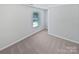 Bedroom with neutral carpet and natural light streaming through the window at 250 Marinna Joy Cir, Rockwell, NC 28138