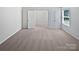 Neutral bedroom with carpet, dual doors, and a bright window with a nice view at 250 Marinna Joy Cir, Rockwell, NC 28138