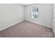 A cozy bedroom with carpet, white walls and a window at 250 Marinna Joy Cir, Rockwell, NC 28138